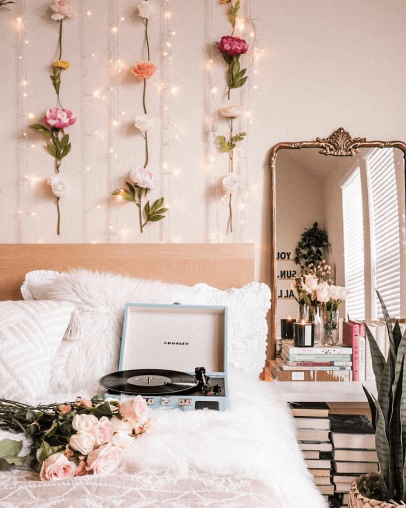 boho room with rose vine garland on wall