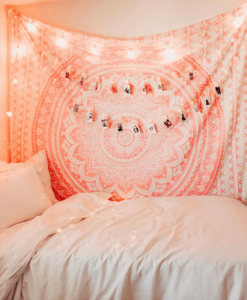 pink tapestry and fairy lights room