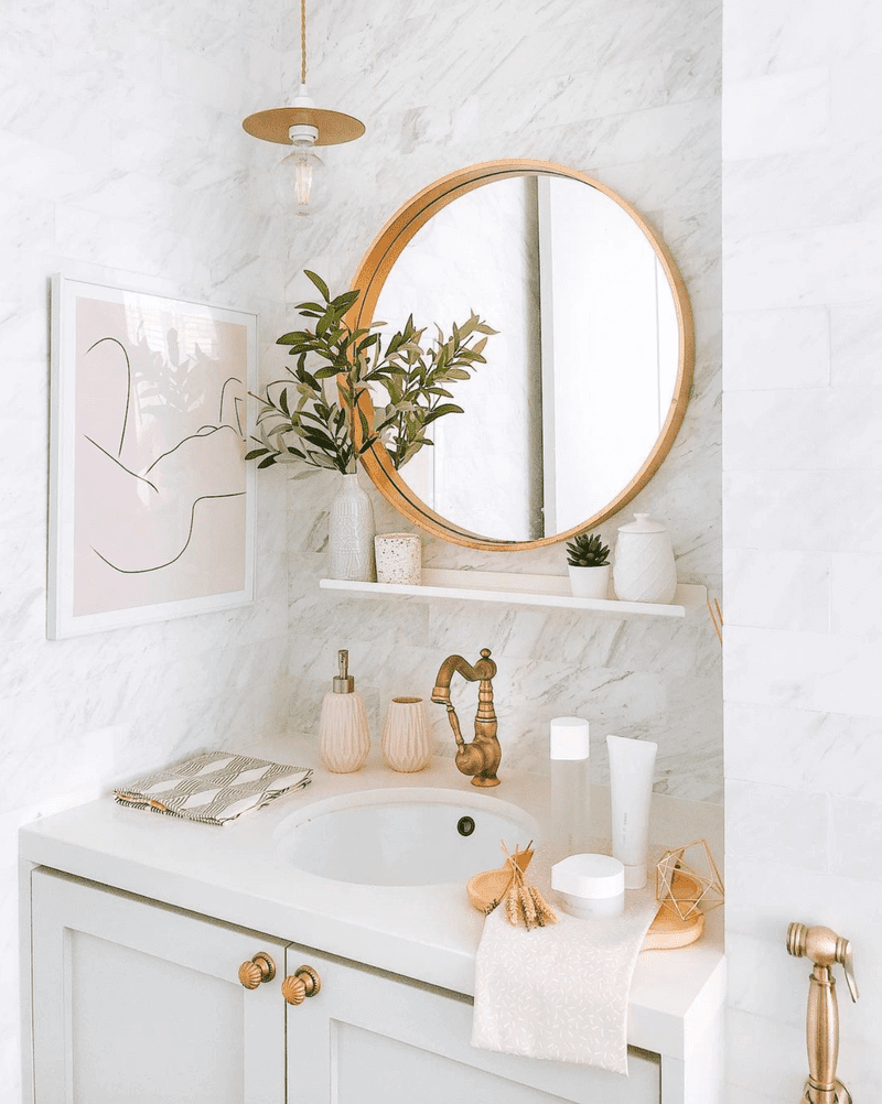 gold and marble small bathroom