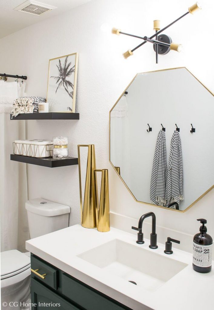 luxurious bathroom with gold decorative accents