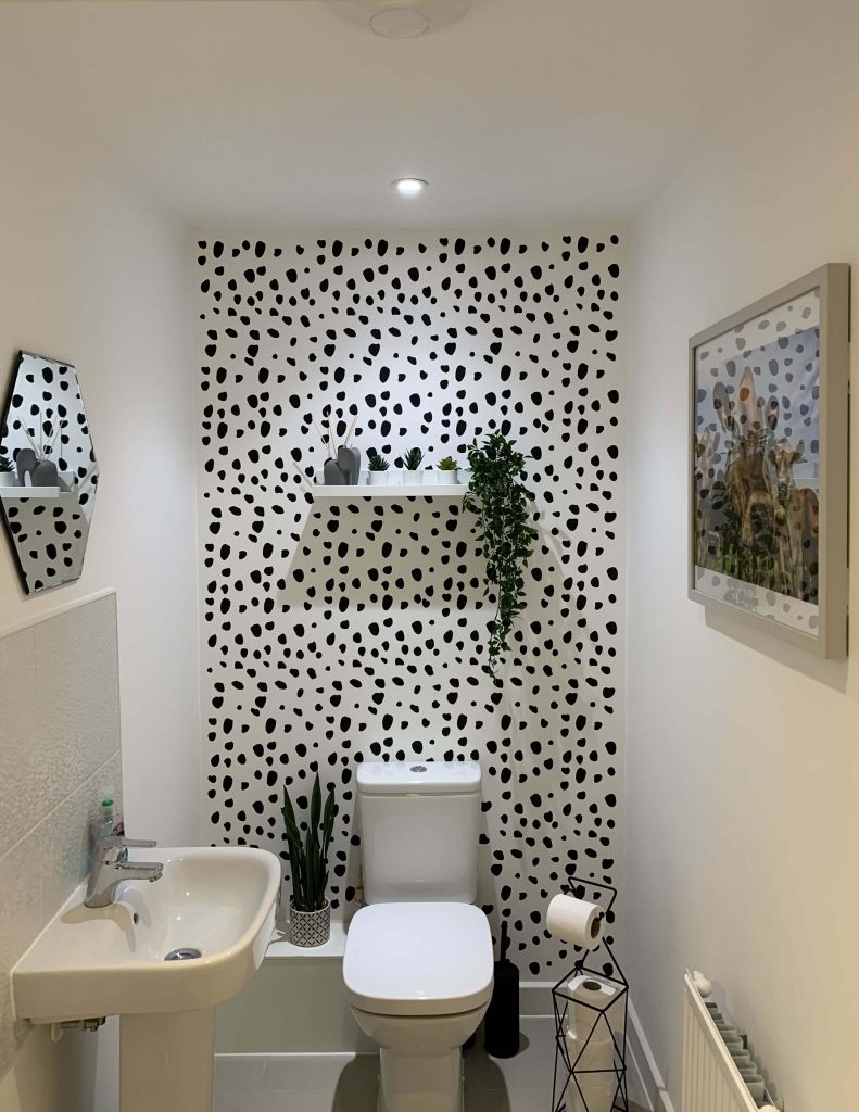 dalmatian wallpaper behind the toilet