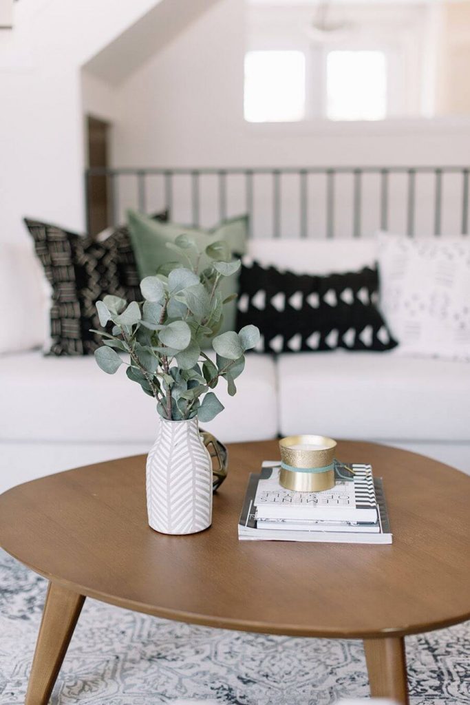 eucalyptus in white vase as coffee table decor
