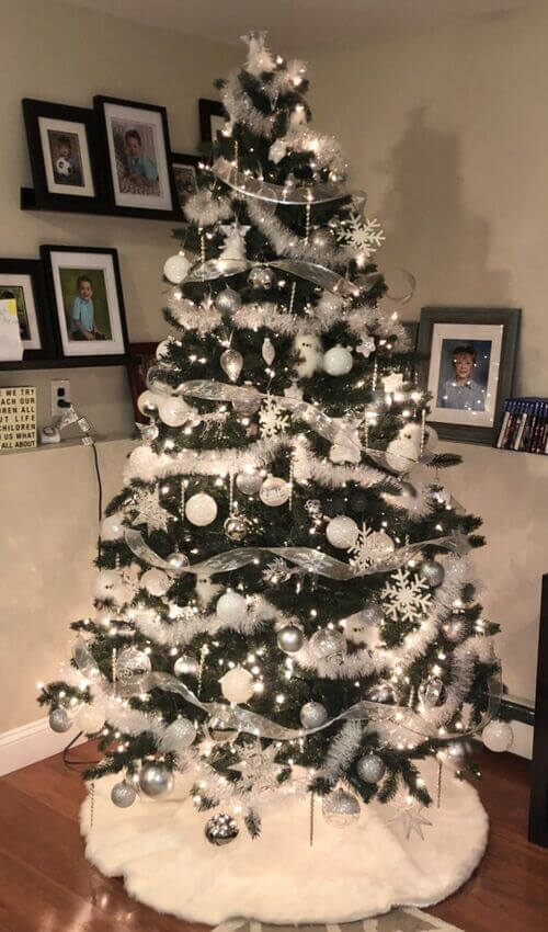 christmas tree with white and silver ornaments