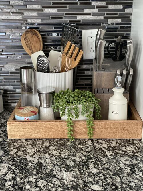 using a tray for kitchen counter decor and utensils