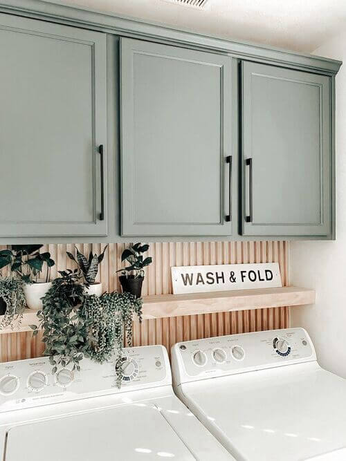 green cabinets in laundry room