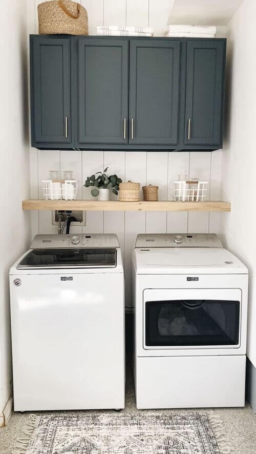 modern laundry room with dark cabinets