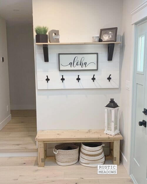 mudroom with bench and coat rack