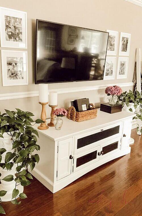 decorate with picture frames next to tv