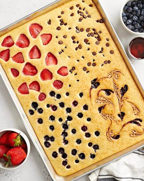 Honey, strawberries, chocolate-chip and blueberries one pan bake